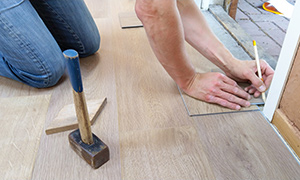 contractor replacing hardwood floors