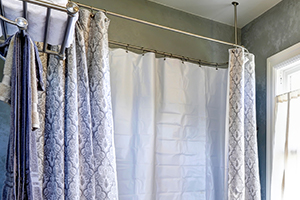 Updating a bathroom includes adding new shower curtains